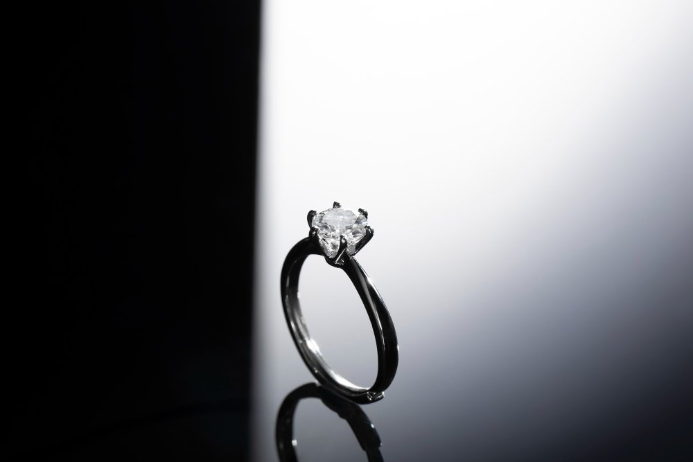 Four prong solitaire diamond ring